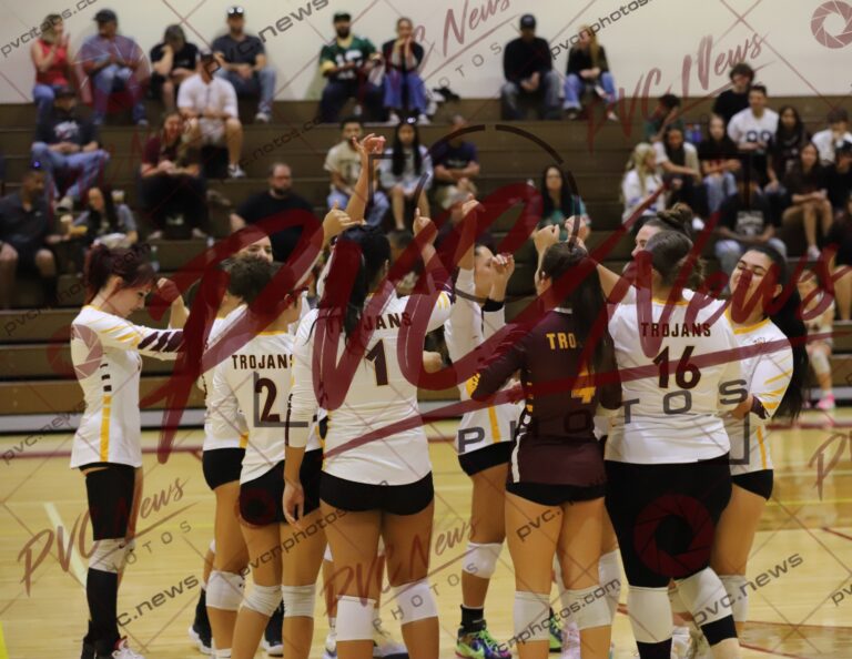 Trojans Push Mustangs Through Four Sets at Home